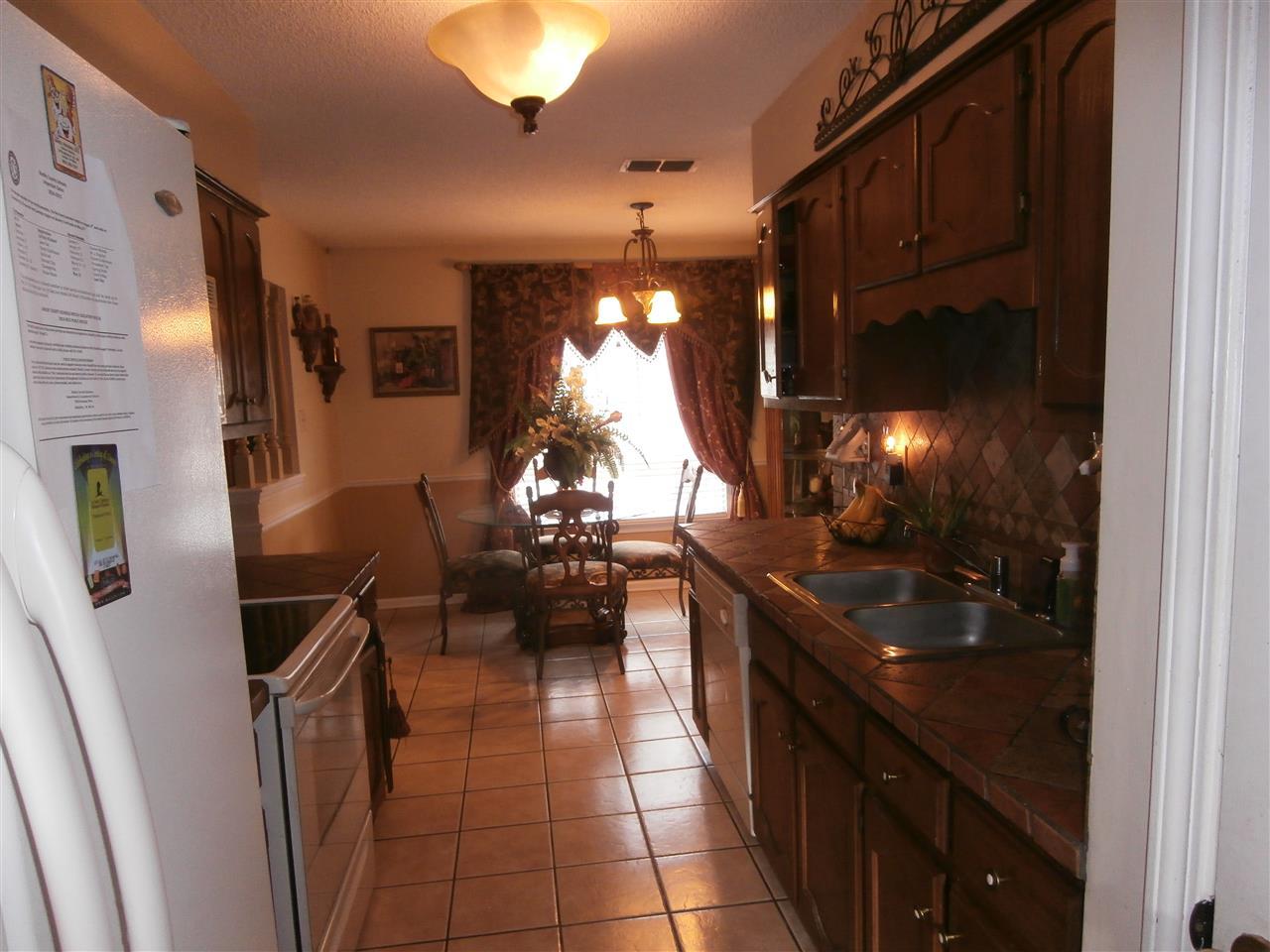 8474 Dulwich Road Memphis, TN 38016 - Photo 4 of 24 New Appliances, flooring, cabinets, counter, custom drapery and 2 ! faux wood blinds! And what about those light fixtures!!!