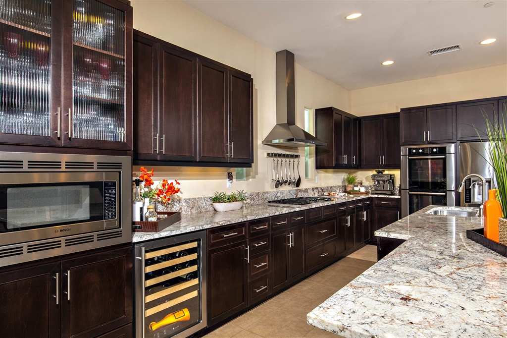 7091 Sitio Caliente Carlsbad, CA 92009 - Photo 3 of 23 High End Stainless Steel Appliances, Beautiful Counters and Cabinetry and Plenty of room to cook and entertain! What more could you ask for?