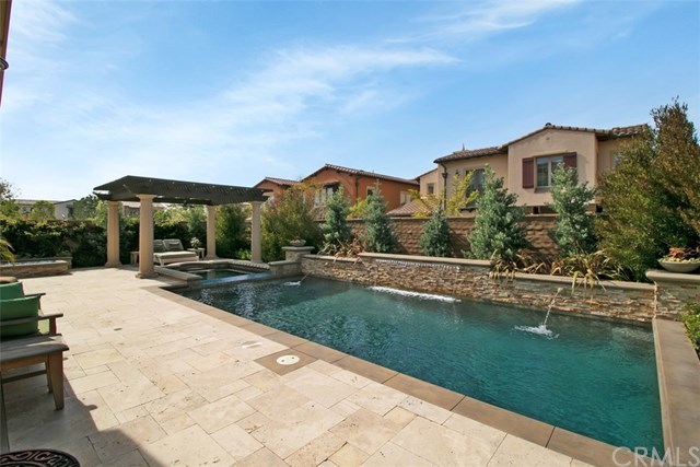 17 Rawhide Irvine, CA 92602 - Photo 31 of 56 Top of the line salt water pool features large waterfall, LED lights, connected jacuzzi spa covered by outdoor structure. High end equipment (Pentair and Jandy) with mobile app control of pool features. Cost of private luxury is kept low with 12-panel 3.7 kilowatt solar power ($125 average electric bill including heating and use of pool features).