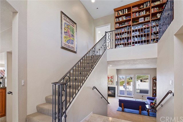 625 Avenida Acapulco San Clemente, CA 92672 - Photo 26 of 48 A GRAND ENTRY SHOWS OFF A LIBRARY ON THE SECOND FLOOR