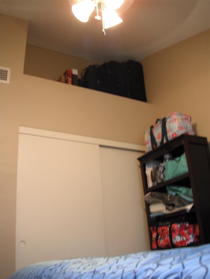 8535 Paradise Valley Road, Unit 56 Spring Valley, CA 91977 - Photo 13 of 24 Bedroom 3 has a large closet and vaulted ceiling that creates a raised alcove for extra storage (in this case: luggage) or for decorator touches.