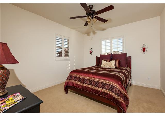 6989 Corte Langosta Carlsbad, CA 92009 - Photo 16 of 25 One of 4 bedroom suites upstairs with its own private bath. Neutral sculptured carpet thru out the home.