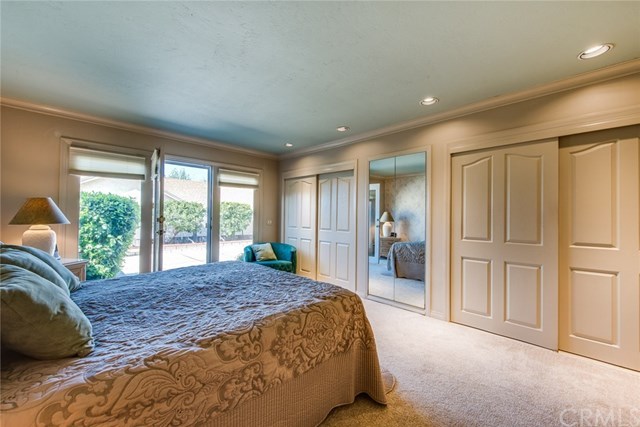 2001 Cypress Point Drive Corona, CA 92882 - Photo 29 of 62 His and her closets with added mirrored closet with drawers