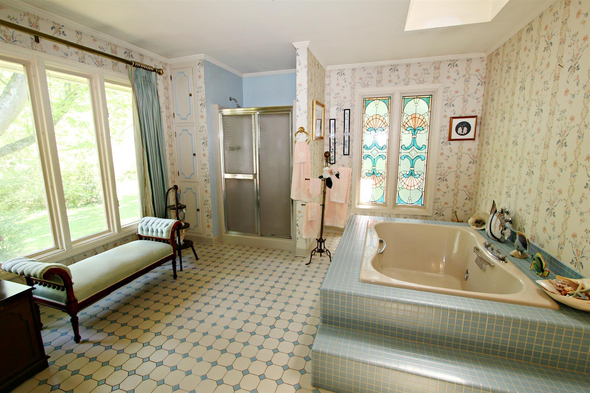 300 Kippsford Pond Road Columbia, TN 38401 - Photo 22 of 36 Extra-large master bath features tile floor, stained-glass windows and picture window overlooking backyard.