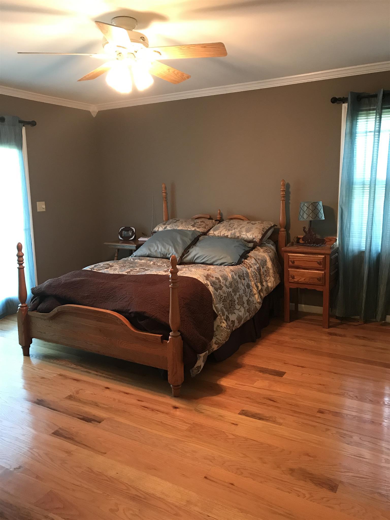 348 Kelso-Smithland Road Kelso, TN 37348 - Photo 8 of 43 On around to the master bedroom. This room has radiant flooring provided by the outside wood heater.
