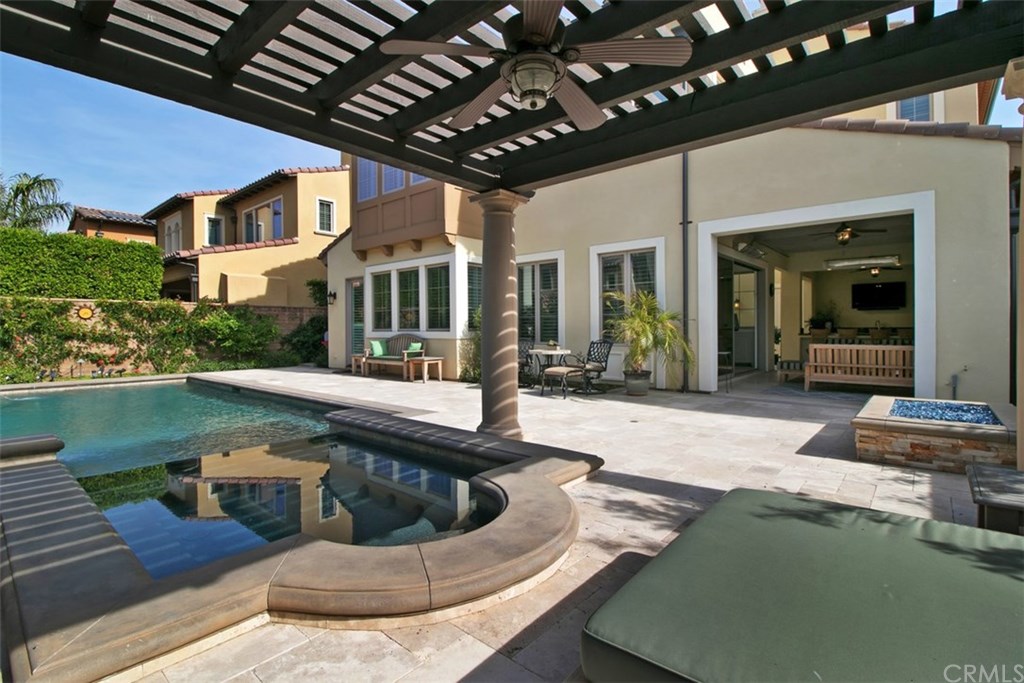 17 Rawhide Irvine, CA 92602 - Photo 29 of 56 Top of the line salt water pool features large waterfall, LED lights, connected jacuzzi spa covered by outdoor structure. High end equipment (Pentair and Jandy) with mobile app control of pool features. Cost of private luxury is kept low with 12-panel 3.7 kilowatt solar power ($125 average electric bill including heating and use of pool features).