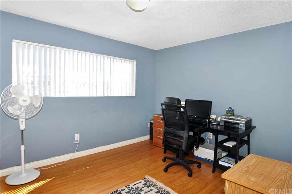 253 17th Street Seal Beach, CA 90740 - Photo 24 of 36 Laminate floors in upstairs bedroom/office