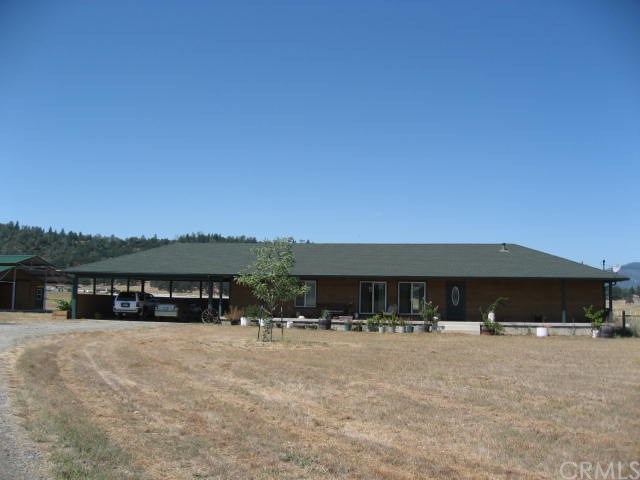 21751 Callayomi Road Middletown, CA 95461 - Photo 1 of 1 21751 Callayomi Rd. has 2005 ranch style home with attached parking carport and a circular driveway.