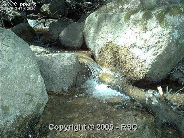 4635 Crystal Park Road Manitou Springs, CO 80829 - Photo 1 of 2 Three Streams Converge at Lake Above and Tumble Through This Site