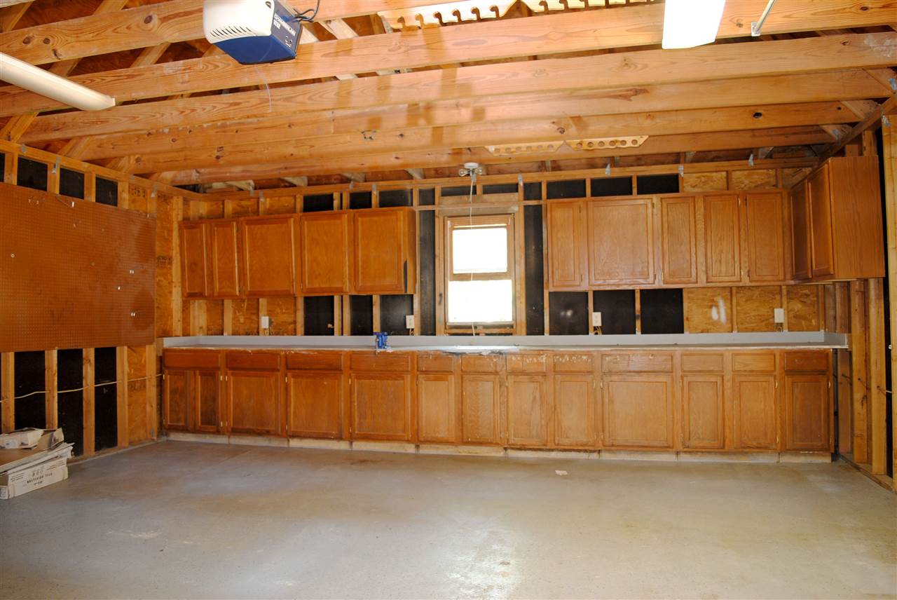 1076 Stanhope Road Collierville, TN 38017 - Photo 23 of 25 Workshop large enough for more than 2 cars. Lots of cabinet space and countertop space for every tool you have.