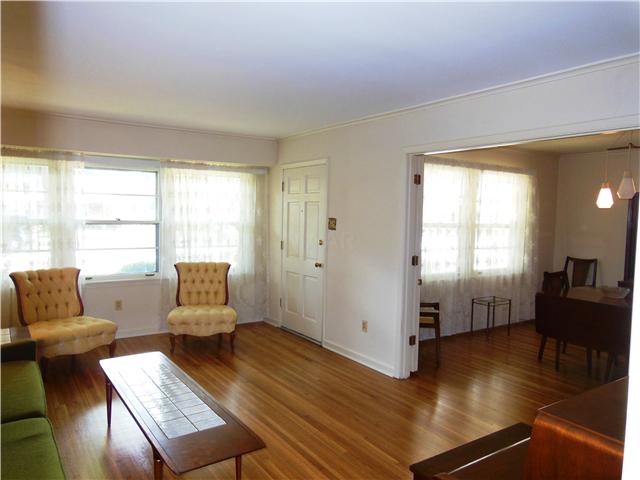 5132 Princeton Road Memphis, TN 38117 - Photo 7 of 11 Notice the original, newly exposed hardwood floors, they are beautiful! Large doorway to the dining room gives this area a very open feeling!