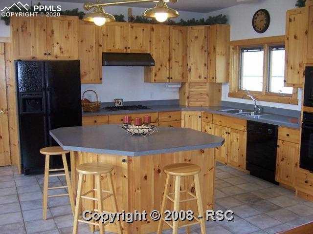 11205 Milam Road Colorado Springs, CO 80908 - Photo 3 of 10 Open Kitchen with Large Island