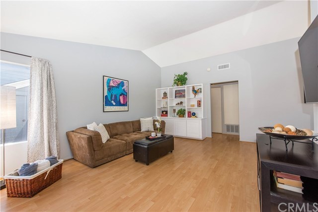 131 Remington, Unit 239 Irvine, CA 92620 - Photo 2 of 36 Lots of windows fill the room with sunshine!