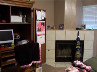 4515 Oregano Road Bakersfield, CA 93313 - Photo 4 of 8 Living area has fireplace.