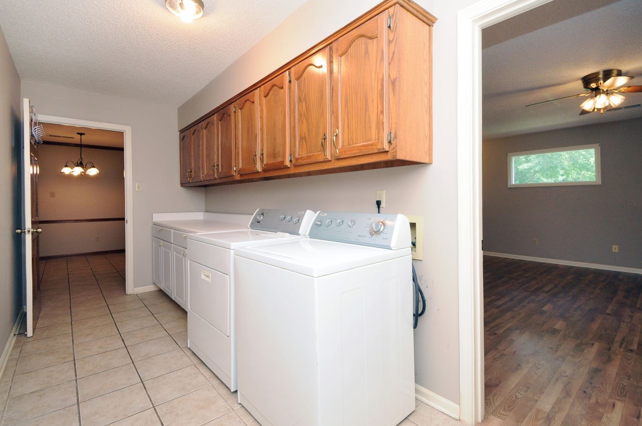 580 Poplar Acres Road Piperton, TN 38017 - Photo 11 of 25 Huge Laundry Room! Laundry And Garage Are Conveniently Located to Kitchen!
