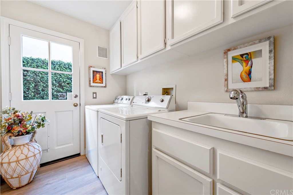 2152 Vallejo Drive Tustin, CA 92782 - Photo 34 of 35 Good size laundry room with wash signs and storage.