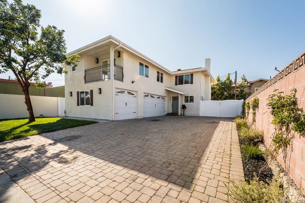 Gorgeous curb appeal. 3 car garage, interlocking paver driveway with RV access.