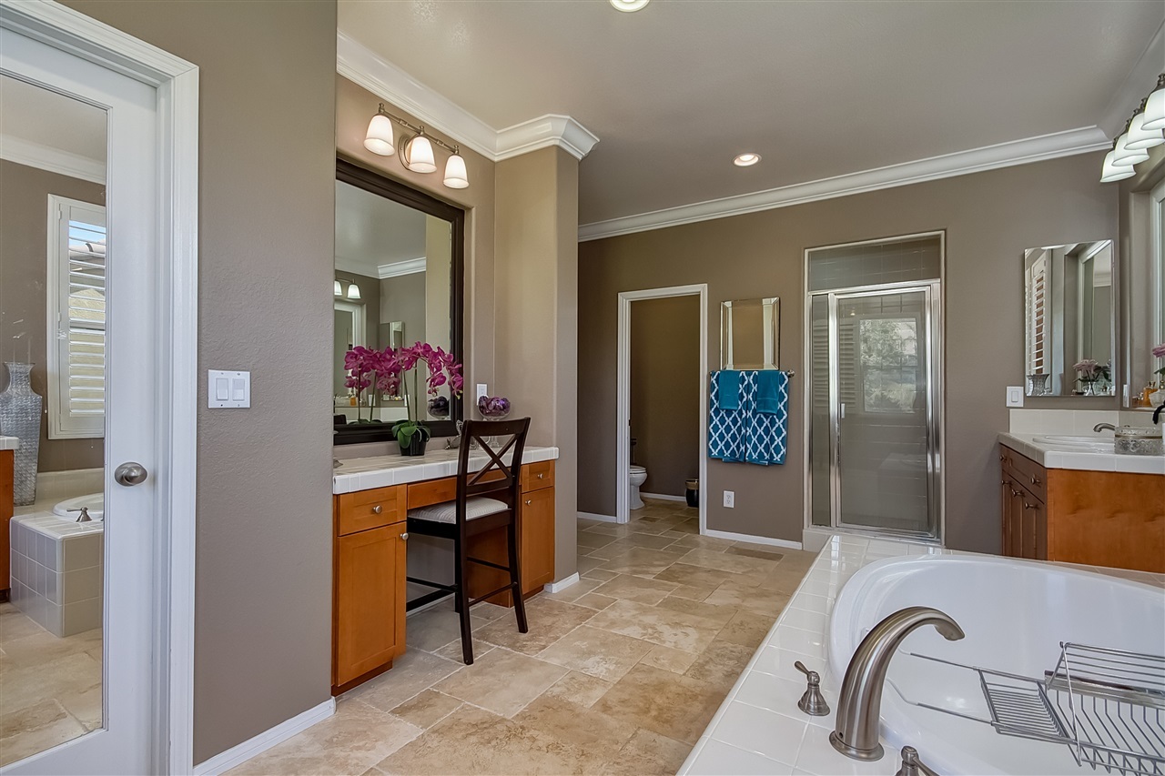 1853 Shadetree Drive San Marcos, CA 92078 - Photo 17 of 25 Large soaking tub, his and her vanity areas as well as an additional vanity area for hair and makeup.
