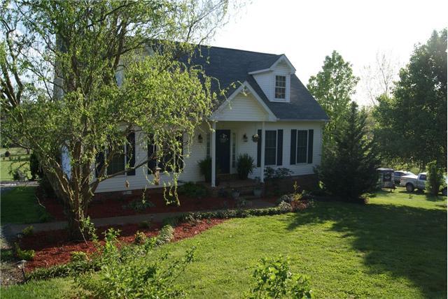 7611 Carr Cemetery Road Cross Plains, TN 37049 - Photo 2 of 22 The yard is landscaped with low maintenance in mind.