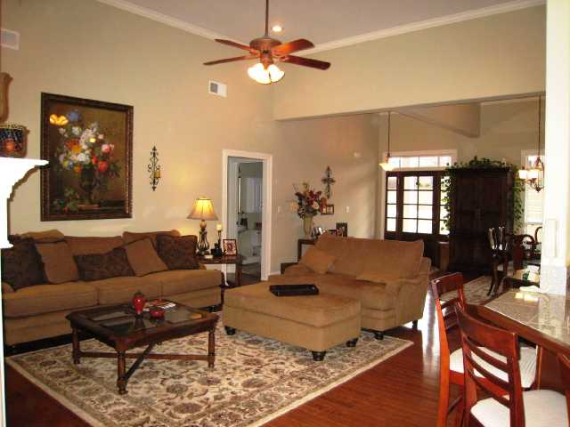1892 Ready Drive Hernando, MS 38632 - Photo 2 of 9 Greatroom is very open with tall ceilings, beautiful fireplace, hardwood floors and great lighting!