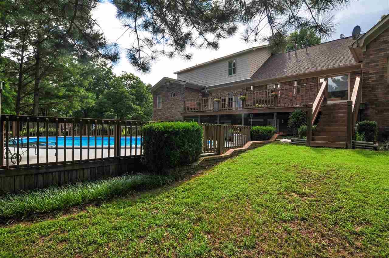 6158 Brunswick Road Lakeland, TN 38002 - Photo 23 of 25 This home features a upper and lower deck and fence that surrounds the pool.