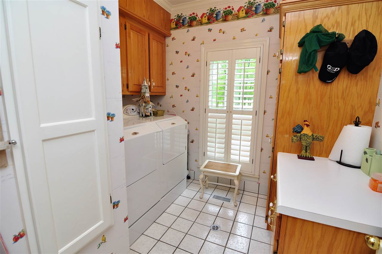 435 Dawson Road Covington, TN 38019 - Photo 16 of 25 The large laundry room is just off the side entrance (from the breezeway) and features plenty of counter and cabinet space.