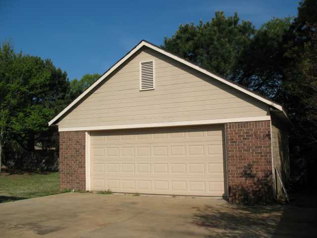 546 Fletcher Road Collierville, TN 38017 - Photo 2 of 12 Extra large second two-car garage for cars, workshop, storage or gameroom. Has electricity, too.....