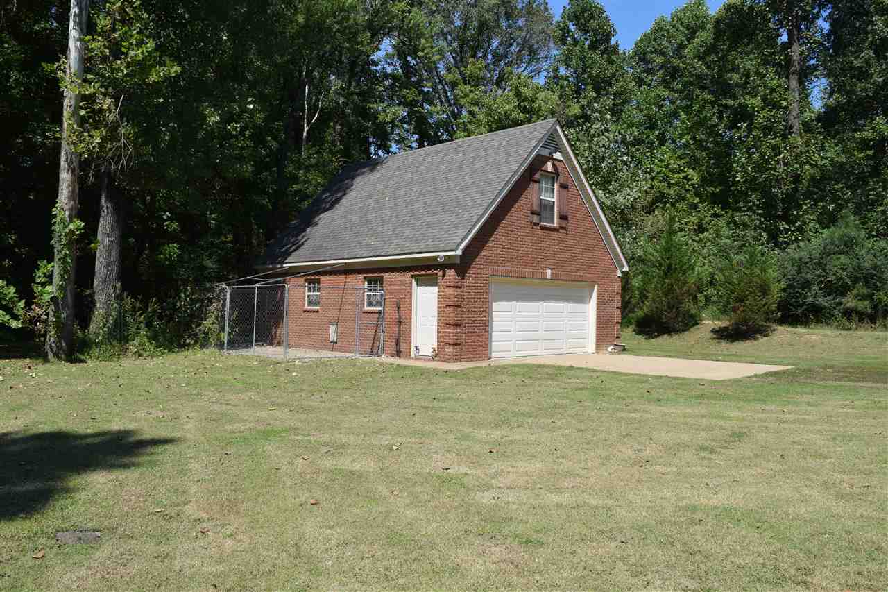 429 Cullum Road Munford, TN 38058 - Photo 21 of 25 30x20 wired garage. It also features stairs leading to expandable or storage.