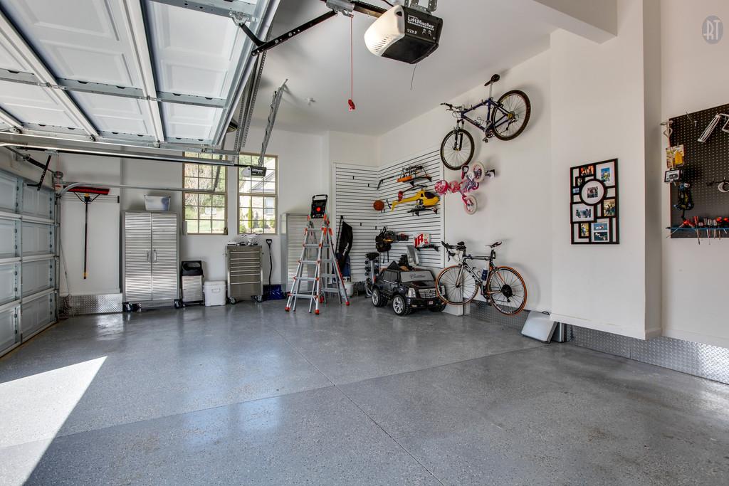 3124 Herbert Drive Franklin, TN 37067 - Photo 34 of 45 3-car garage with epoxy flooring, diamond plate, and slat wall storage