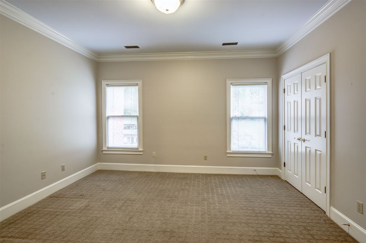 2044 Steeplebrook Drive Memphis, TN 38016 - Photo 15 of 25 Downstairs ~ Replaced Carpet 2016 ~ Built in Closet ~ Crown Molding ~ Smooth Ceiling