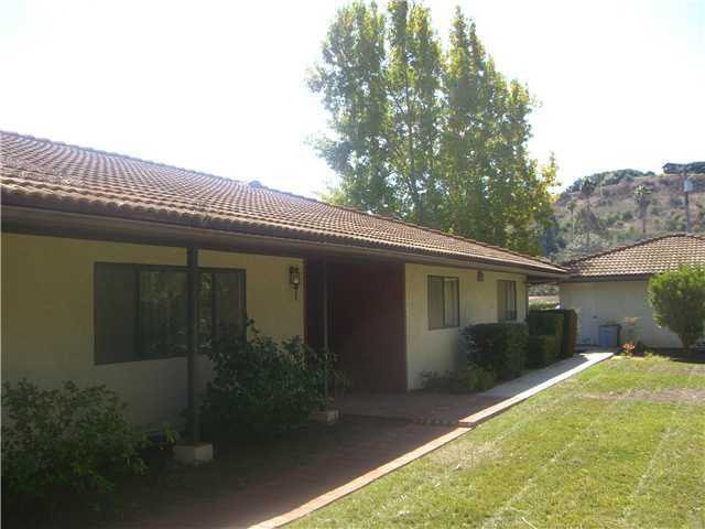 5057 Sleeping Indian Road Fallbrook, CA 92028 - Photo 1 of 17 Front of home is tucked back privately from driveway.