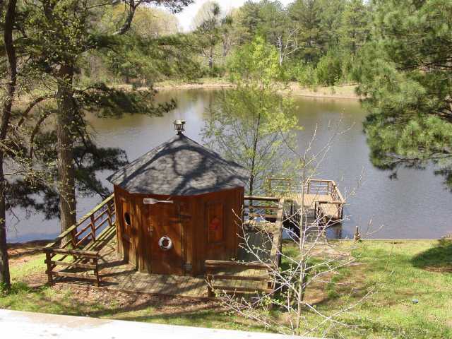 485 Bethany Road Eads, TN 38028 - Photo 3 of 8 Spacious octagon shaped storage building on large deck overlooking beautiful lake.