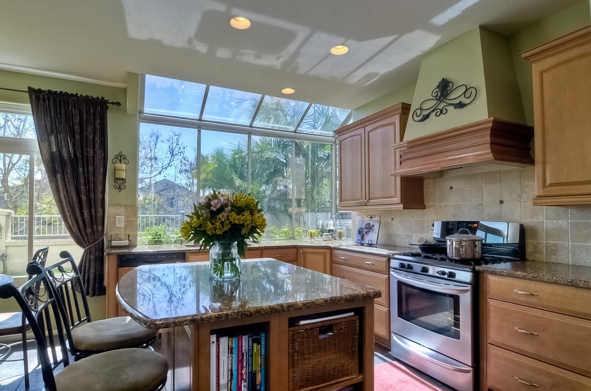 2315 Terraza Ribera Carlsbad, CA 92009 - Photo 10 of 25 EAT AT CENTER GRANITE COUNTERTOP ISLAND