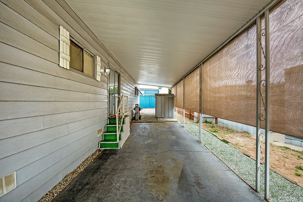 1630 Barranca Avenue, Unit 113 Glendora, CA 91740 - Photo 20 of 33 ATTACHED CARPORT FITS TWO AUTOMOBILES AND HAVE FIT UP TO 3 AUTOMOBILES, WITH SIDE ACCESS TO THE FAMILY ROOM AND KITCHEN - TWO STORAGE SHEDS LOCATED AT THE END OF THE DRIVEWAY