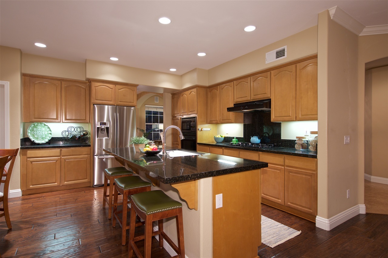 1046 Turnstone Road Carlsbad, CA 92011 - Photo 4 of 25 Granite counter tops with seating, breakfast nook & walk in pantry.