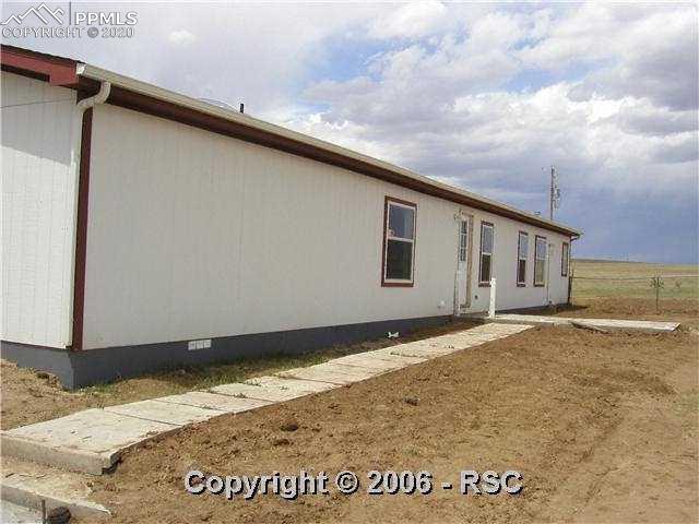 2280 Liahona Point Yoder, CO 80864 - Photo 4 of 8 Back sidewalk will connect to garage.