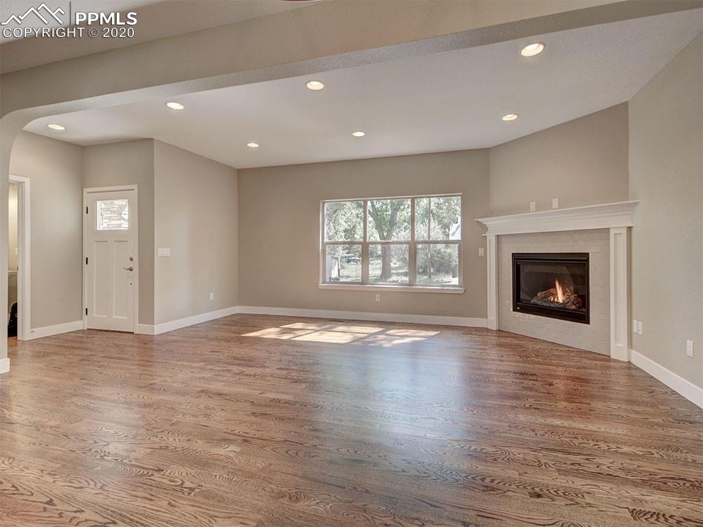 208 Custer Avenue Colorado Springs, CO 80903 - Photo 5 of 36 Open family room, 1/2 powder bath to the left.