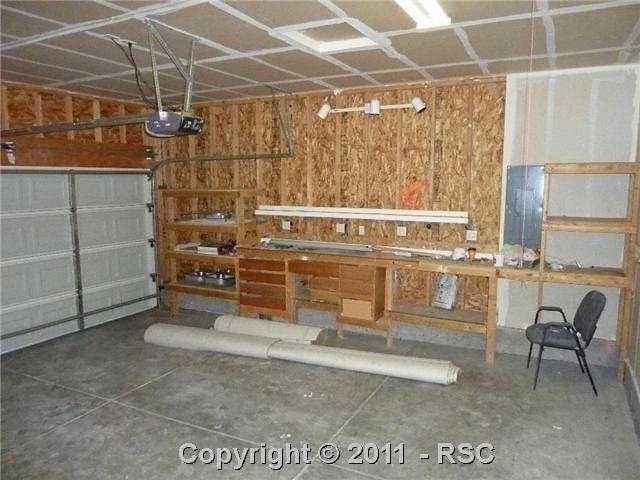 12337 Crystal Downs Road Peyton, CO 80831 - Photo 13 of 13 2 car attached garage with built in work space!