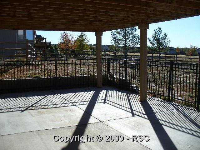 1375 Bowstring Road Monument, CO 80132 - Photo 9 of 9 Fenced patio below deck