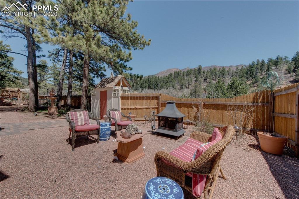 7955 Highway 24 Cascade, CO 80809 - Photo 32 of 36 Sitting area off the covered patio in the front of the house