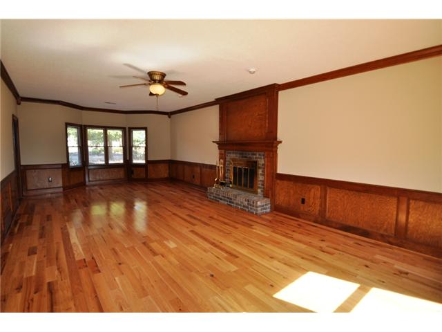 727 West Powell Road Collierville, TN 38017 - Photo 5 of 12 Huge great room with wood-burning fireplace, beautiful hardwoods, and a bay window. Freshly painted!