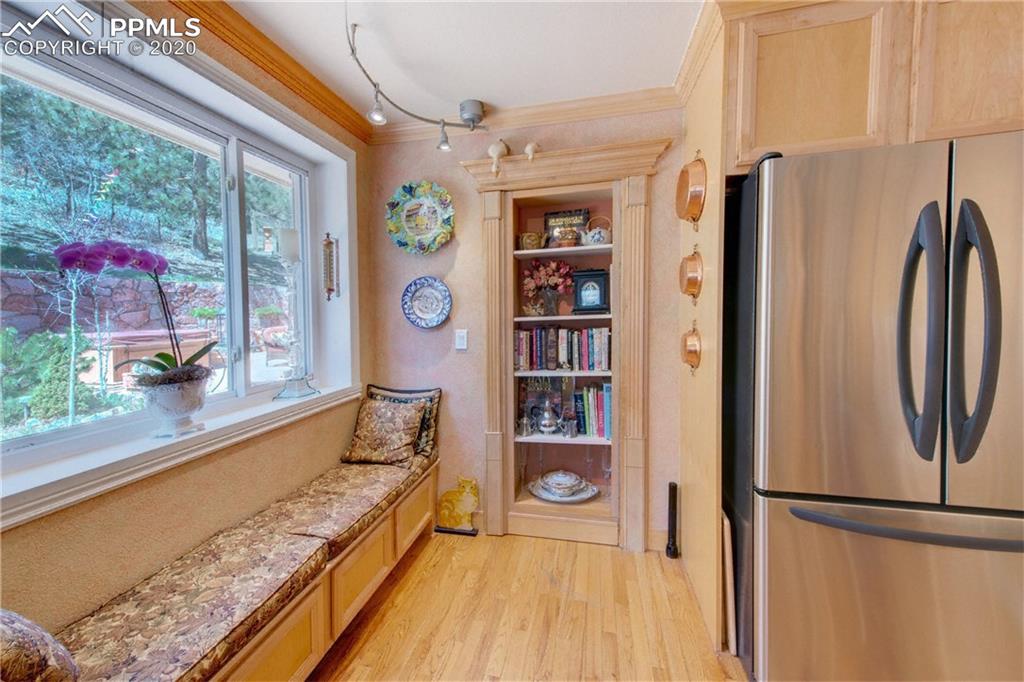 7955 Highway 24 Cascade, CO 80809 - Photo 12 of 36 A spacious pantry is hiding behind this lovely bookshelf.