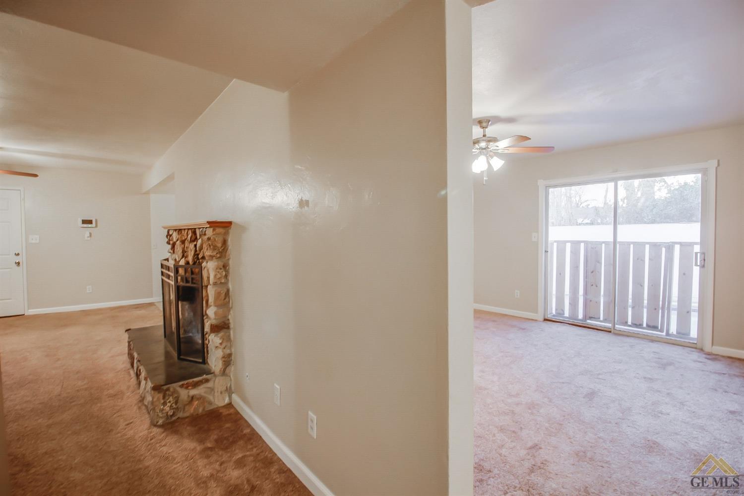 1512 Locust Ravine Bakersfield, CA 93306 - Photo 5 of 28 Double sided fireplace in the living room