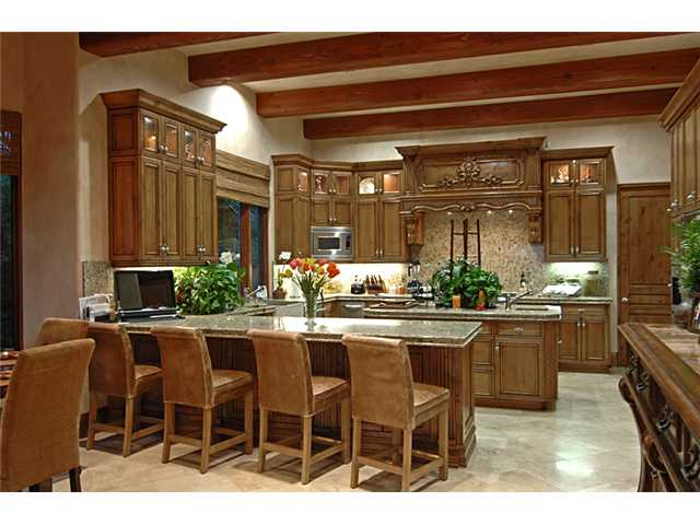 6890 St Andrews Road Rancho Santa Fe, CA 92067 - Photo 5 of 15 Grand full Chef's kitchen with all of the most modern appliances. Two dishwashers, sub-zero side by side refrigerator/freezer, Wolf range and ovens, under counter refrigerator drawers and much more.