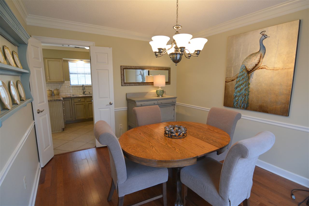 451 Park Hill Road Collierville, TN 38017 - Photo 8 of 25 Quality crown molding and chair rail molding add finishing touches to the dining room.