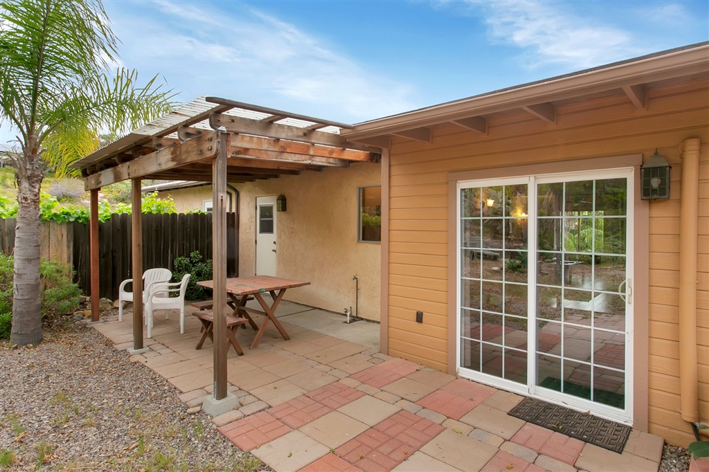 1387 Peacock Boulevard Oceanside, CA 92056 - Photo 12 of 15 Covered patio off sliding doors looks out into the spacious back yard.