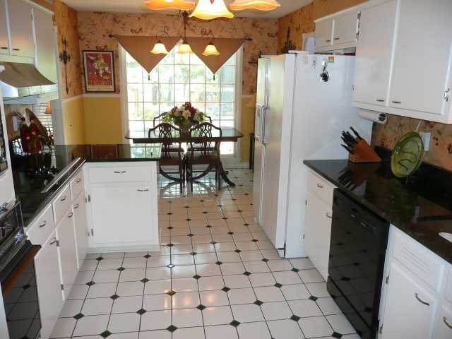 5676 Rich Road Memphis, TN 38120 - Photo 6 of 12 Granite counters, tile floor and new hardware