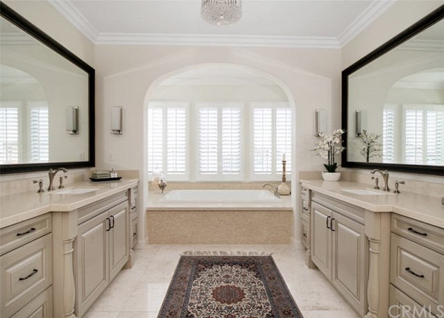 17 Rawhide Irvine, CA 92602 - Photo 21 of 56 Master bathroom features marble bath flooring, caesarstone counters, bathtub backsplash all lit with a beautiful Swarovski crystal chandelier.