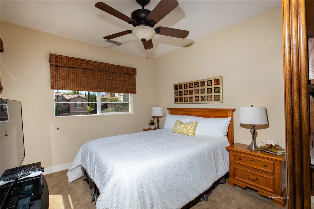 7091 Sitio Caliente Carlsbad, CA 92009 - Photo 12 of 23 Guest bedroom with ensuite bath for you visitors comfort and privacy