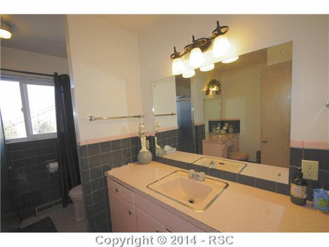 1307 Prairie Road Colorado Springs, CO 80909 - Photo 12 of 20 Huge bath with separate vanity and large, deep tub